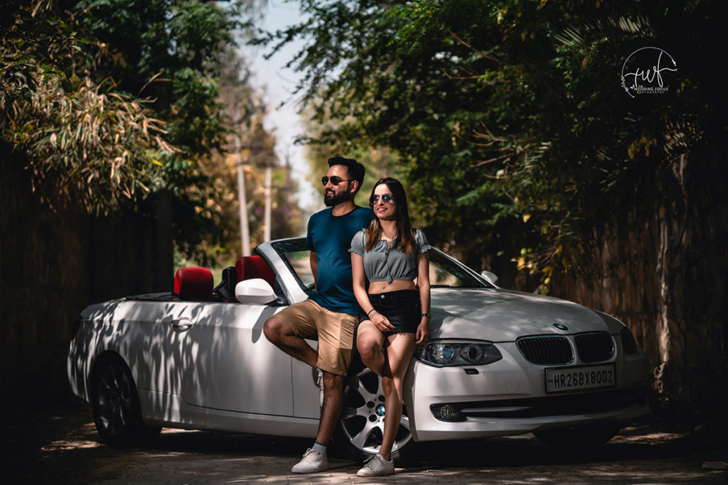 Woman In Blue Tank Top Sitting On Silver Mercedes Benz Couple New Delhi